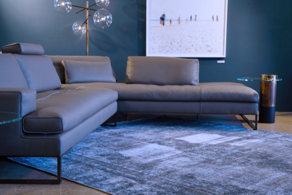 blue-grey-vintage-rug-under-modern-sofa